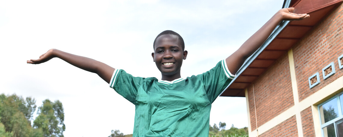 viola poses with her arms outside homes of hope