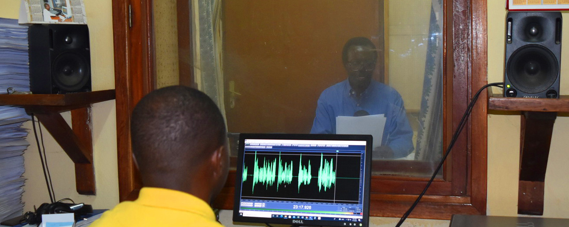 Trans World radio studio booth recording taking place