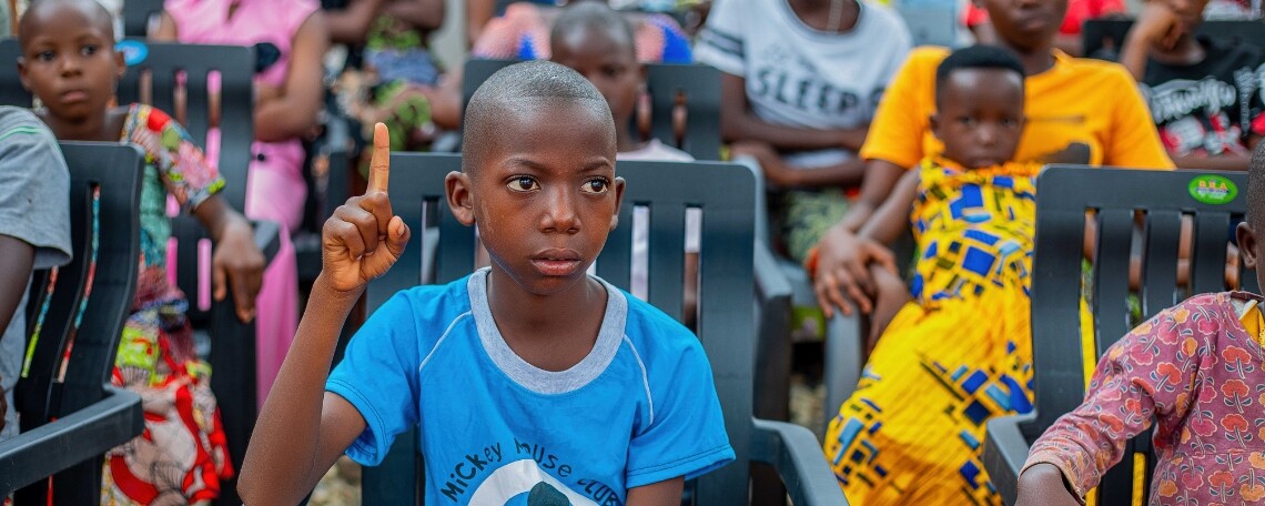 Community Rise - boy asking a question