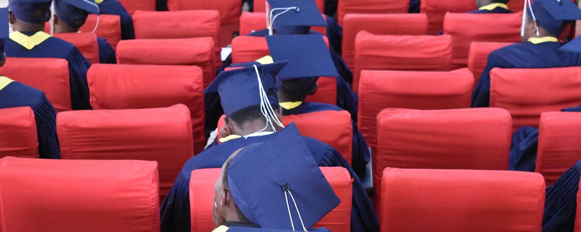 socially-distanced graduates of antioch school in caps and gowns