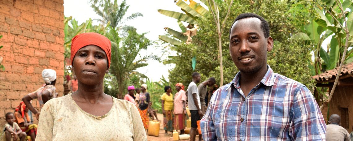 Bosco with Boudesie in front of other villagers